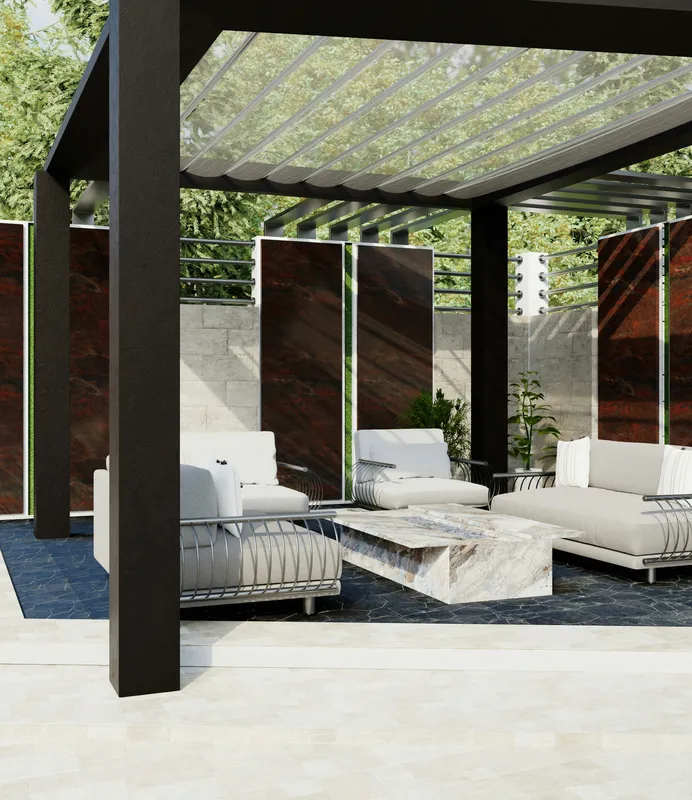 Pergola aluminium avec dallage en pierre rouge et salon de jardin blanc, structure bien entretenue