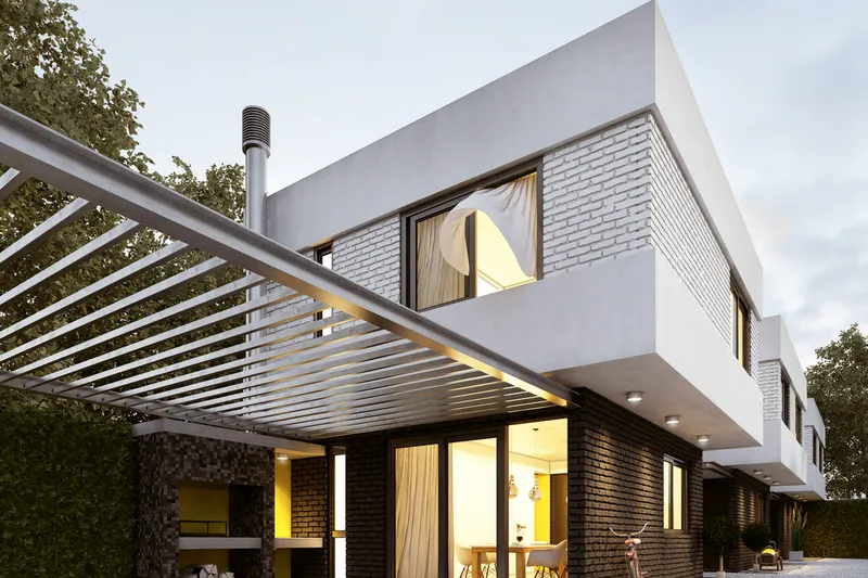 Pergola bioclimatique adossée à une maison, prolongeant la pièce de vie sur la terrasse